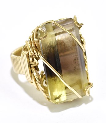 Lot 1018 - A yellow metal dress ring set with a large...