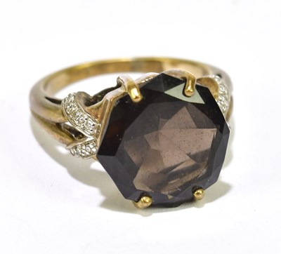 Lot 1033 - A 9ct yellow gold dress ring set with a single...