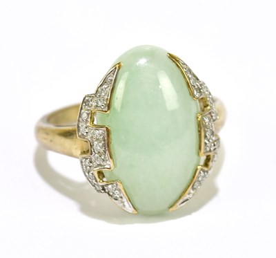 Lot 1083 - A yellow metal dress ring set with a pale...