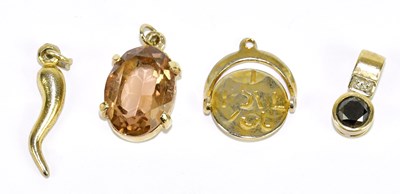 Lot 1242 - A 9ct yellow gold swivel pendant set with a...