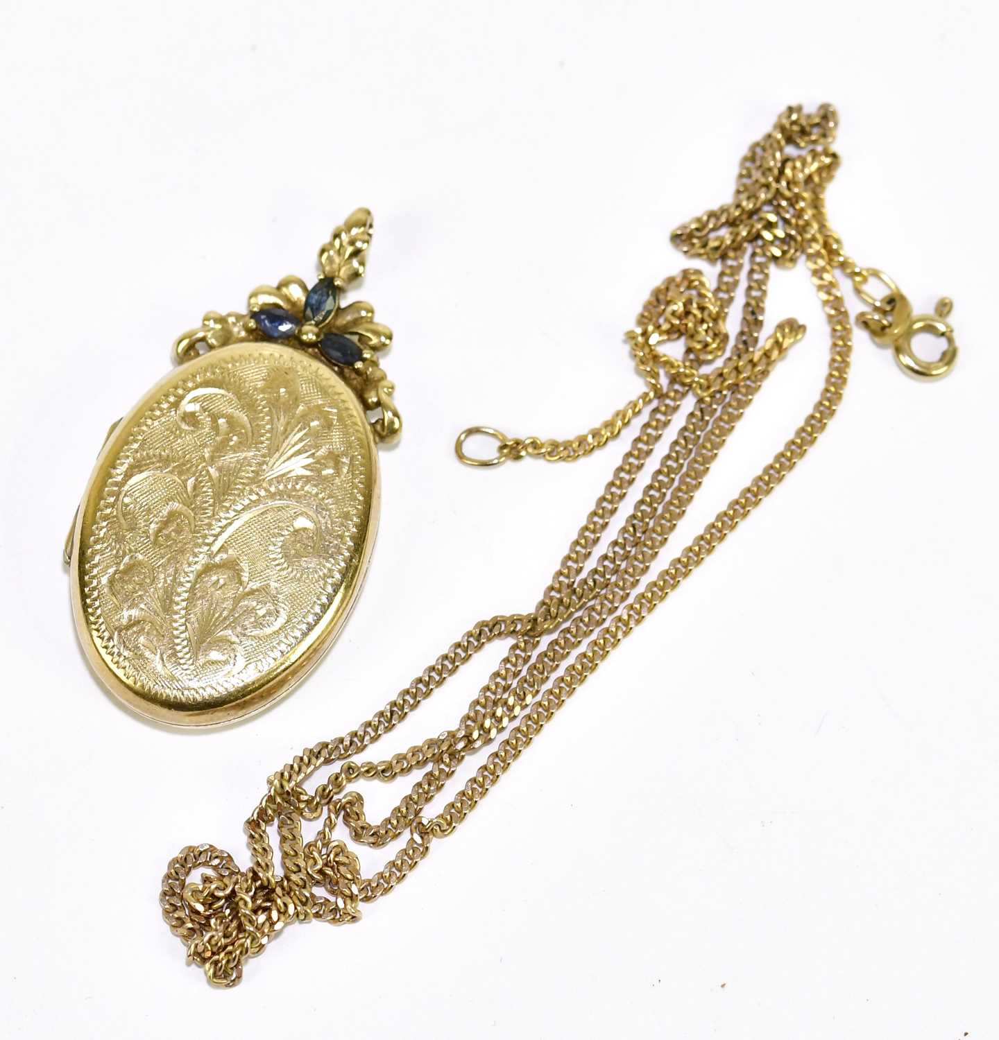 Lot 1229 - A 9ct yellow gold locket of oval form with...