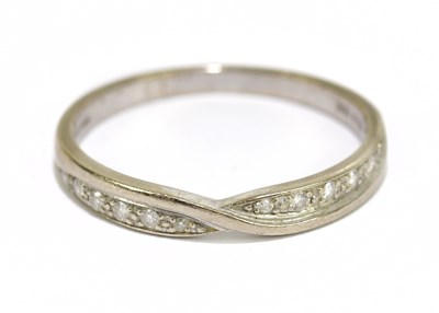 Lot 1048 - An 18ct white diamond set gold half eternity...
