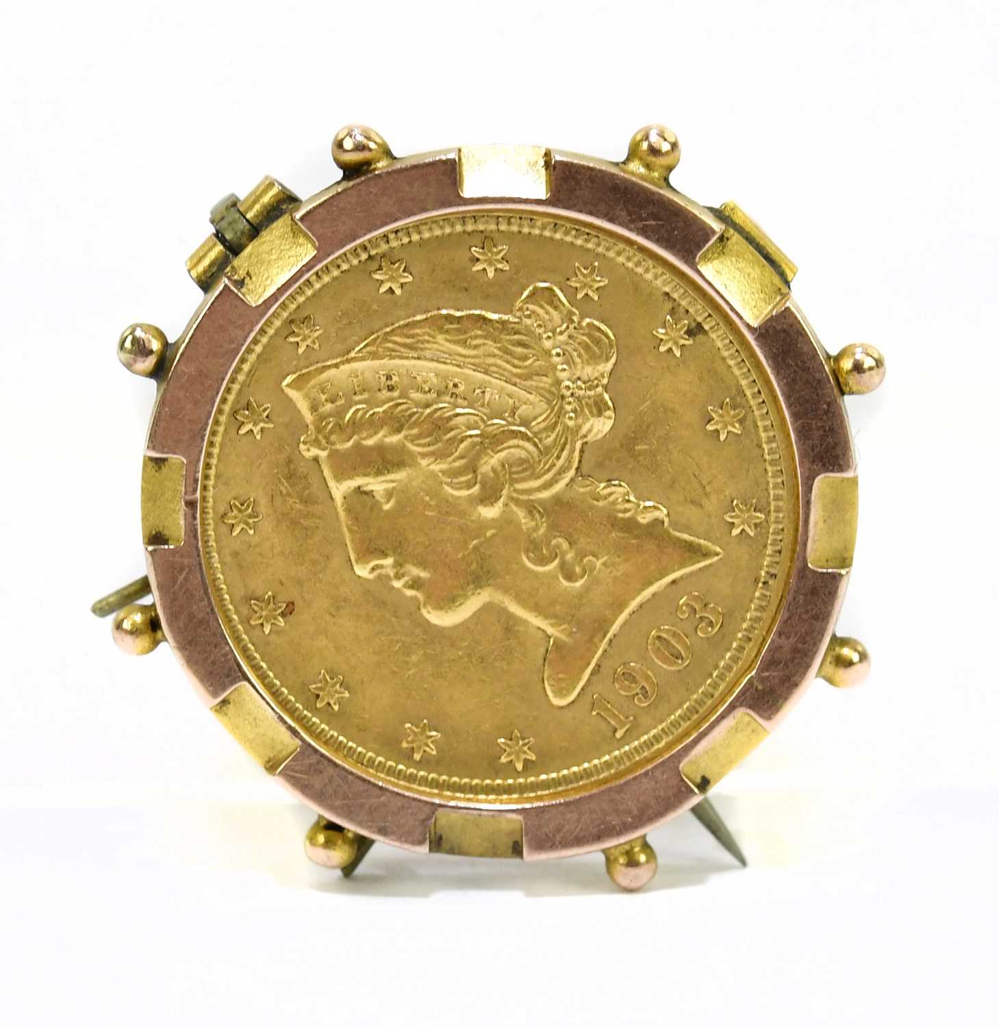Lot 1234 - A 1903 gold Liberty coin set within a 9ct...