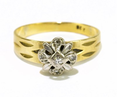 Lot 1042 - An 18ct yellow gold diamond set cluster ring,...
