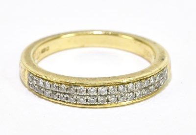 Lot 1016 - An 18ct yellow gold diamond set half eternity...