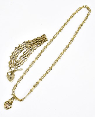 Lot 910 - A 9ct fancy link chain with pendant, approx....