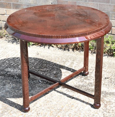 Lot 63 - A modern circular occasional table raised on...