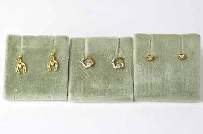 Lot 1188 - Three pairs of 9ct gold pierced earrings,...