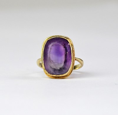 Lot 902 - A 9ct gold dress ring set with an amethyst...
