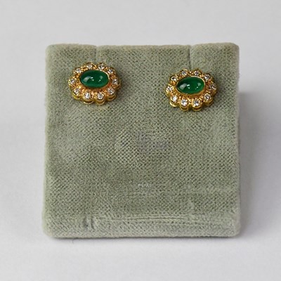 Lot 1175 - A pair of 9ct gold emerald and diamond set...