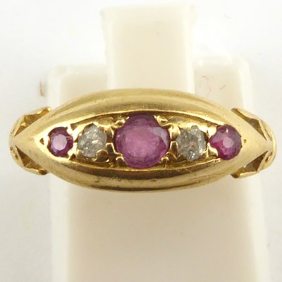 Lot 978 - An 18ct gold ruby and tiny rose cut diamond...