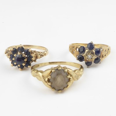 Lot 921 - Three 9ct gold dress rings comprising a...
