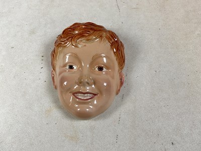 Lot 169 - BESWICK; a face mask modelled as a young boy,...