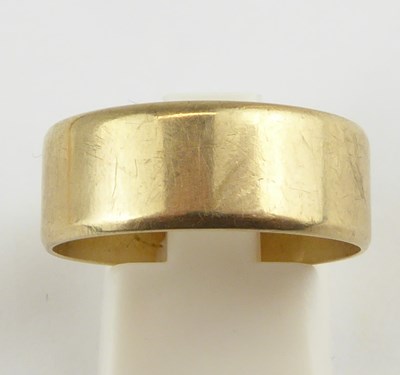 Lot 932 - A 9ct gold wide band ring, size T, approx. 4.2g.