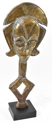 Lot 6 - A Kota reliquary figure, Gabon, brass applied...