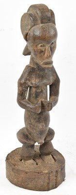 Lot 38 - A Fang, Gabon, figure set in a rustic wooden...