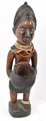 Lot 41 - A Baule, Ivory Coast, figure with bead...