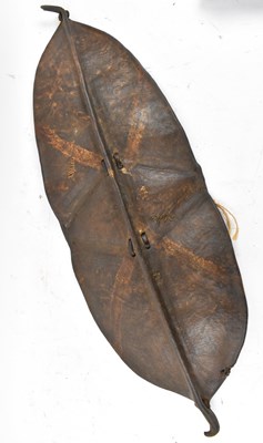 Lot 44 - An African hide shield with traces of painted...