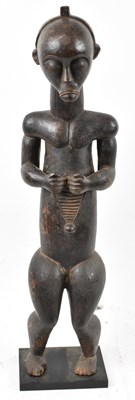 Lot 49 - A Fang, Gabon, standing figure mounted on a...