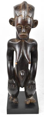 Lot 50 - A Punu, Gabon, standing figure mounted on...