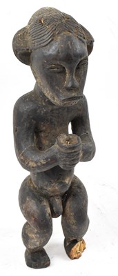 Lot 58 - A Baule, Ivory Coast, standing figure (af),...