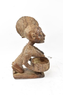 Lot 61 - A Yoruba, Nigeria, figural bowl with traces of...