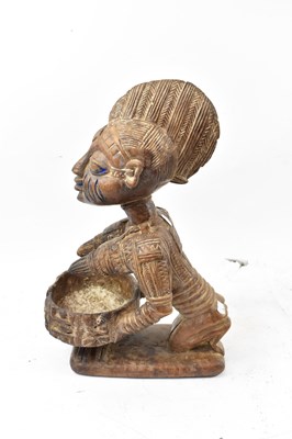 Lot 61 - A Yoruba, Nigeria, figural bowl with traces of...