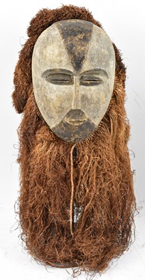 Lot 65 - A Galoa People, Gabon, mask with raffia detail...