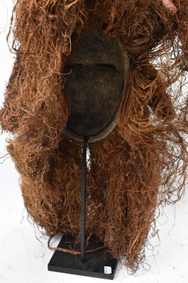 Lot 65 - A Galoa People, Gabon, mask with raffia detail...