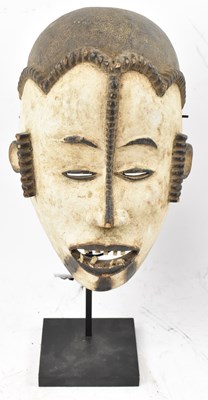 Lot 67 - An Idoma, Nigeria, mask with black and white...