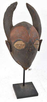 Lot 68 - A Baule, Ivory Coast, horned masked with...