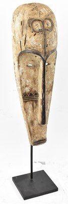 Lot 70 - A Fang, Gabon, elongated mask with white...