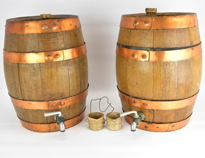 Lot 141 - Two coopered oak wine barrels/casks with...