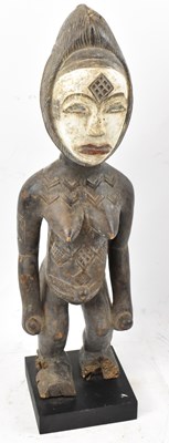 Lot 103 - A Yuruba, Nigeria, standing figure with traces...