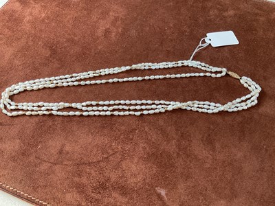 Lot 322 - A three strand freshwater pearl necklace with...