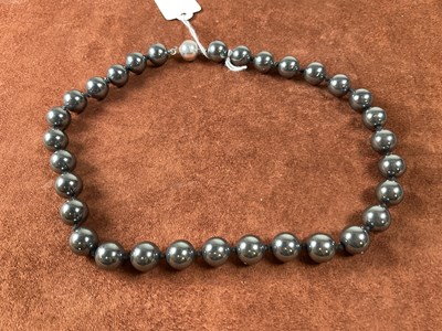 Lot 323 - A hand tied haematite bead necklace, length 47cm.