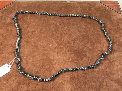 Lot 342 - A rough cut haematite necklace, length 86cm.