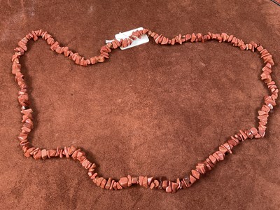 Lot 346 - A rough cut goldstone necklace, length 84cm.