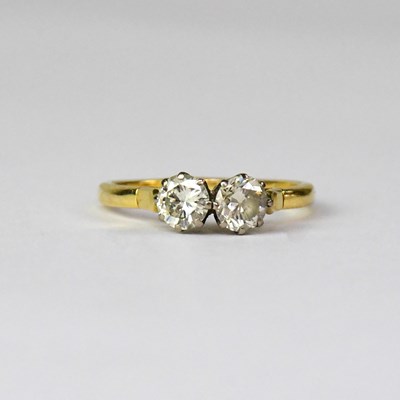 Lot 850 - A yellow metal ring set with two 0.5ct...