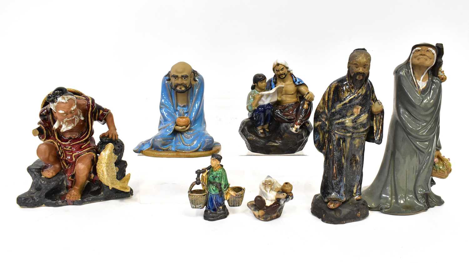 Lot 332 - Six ceramic Oriental figures of varying forms...