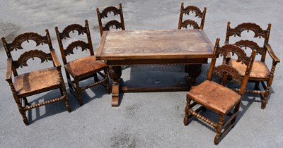 Lot 2551 - A reproduction oak extending refectory table...