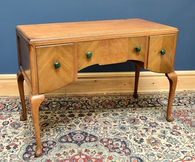 Lot 2466 - A 1930s walnut dressing table, with three...