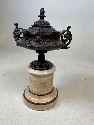 Lot 224 - A neo-classical style urn with integral mable...