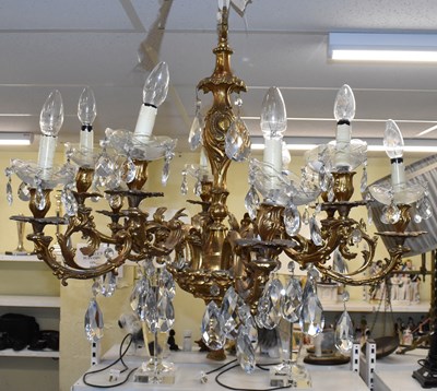 Lot 82 - A pair of French style gilt brass chandeliers...