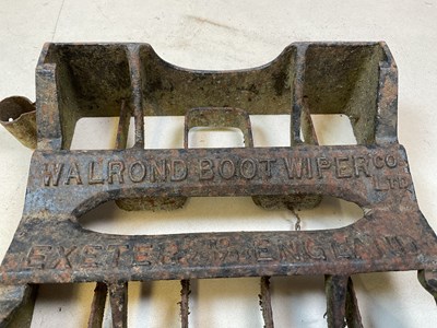 Lot 583 - A cast iron boot wiper by Exeter Waldron Co...