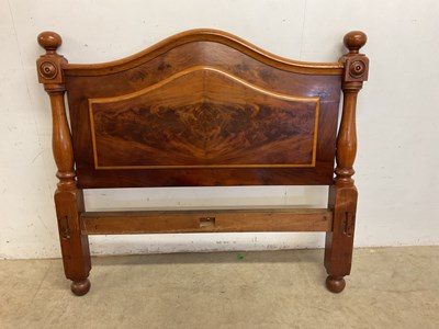 Lot 523 - A flame mahogany bed head, no base or end,...