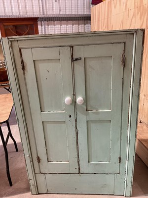 Lot 491 - Two green painted pine kitchen cupboards,...