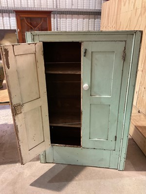 Lot 491 - Two green painted pine kitchen cupboards,...