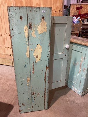 Lot 491 - Two green painted pine kitchen cupboards,...