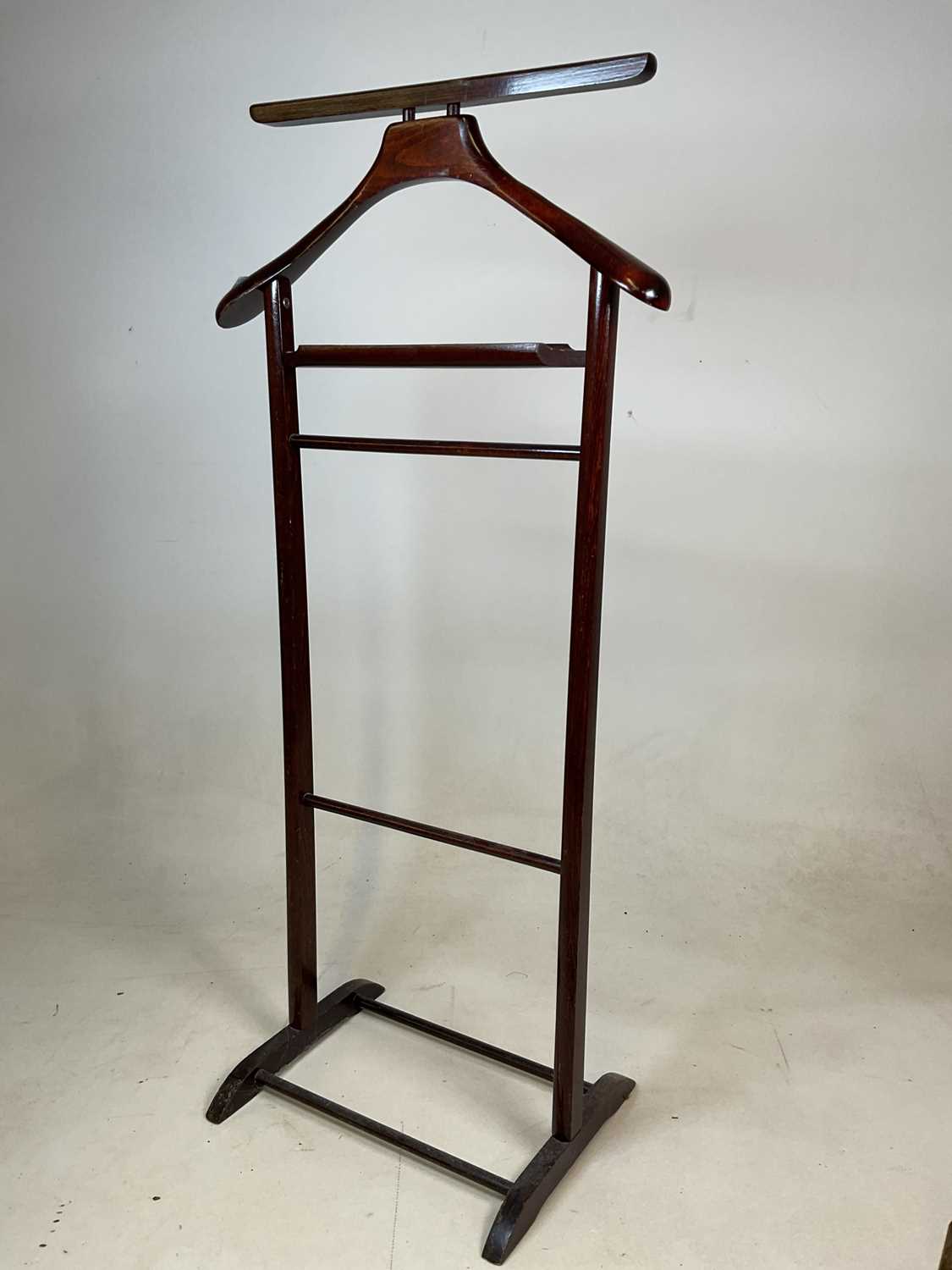 Lot 524 A wooden freestanding valet suit stand, and